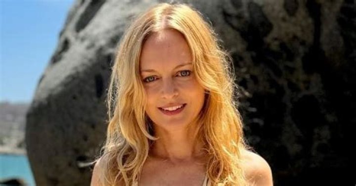 Heather Graham, 54, sparks debate in micro bikini: 'She doesn't age'